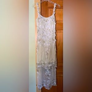 Cache Woman’s beaded sequined & leaf appliqué gown.